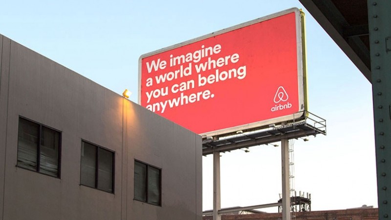 airbnb slogan on billboard